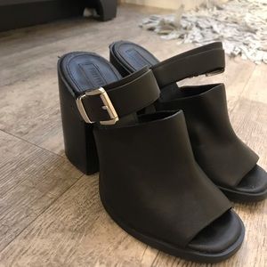 Black heeled mules